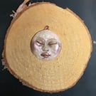 Hand sculpted moon face pendant