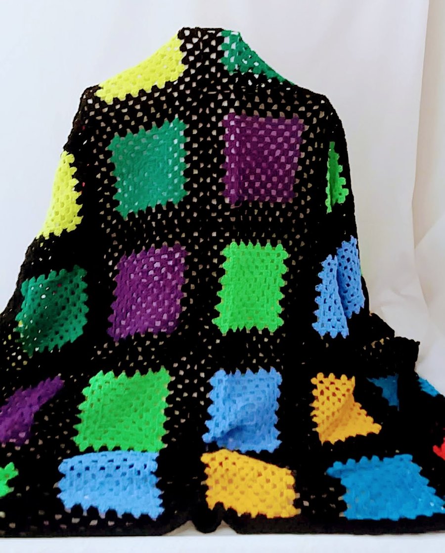 Crochet blanket in bright and cheerful colours.