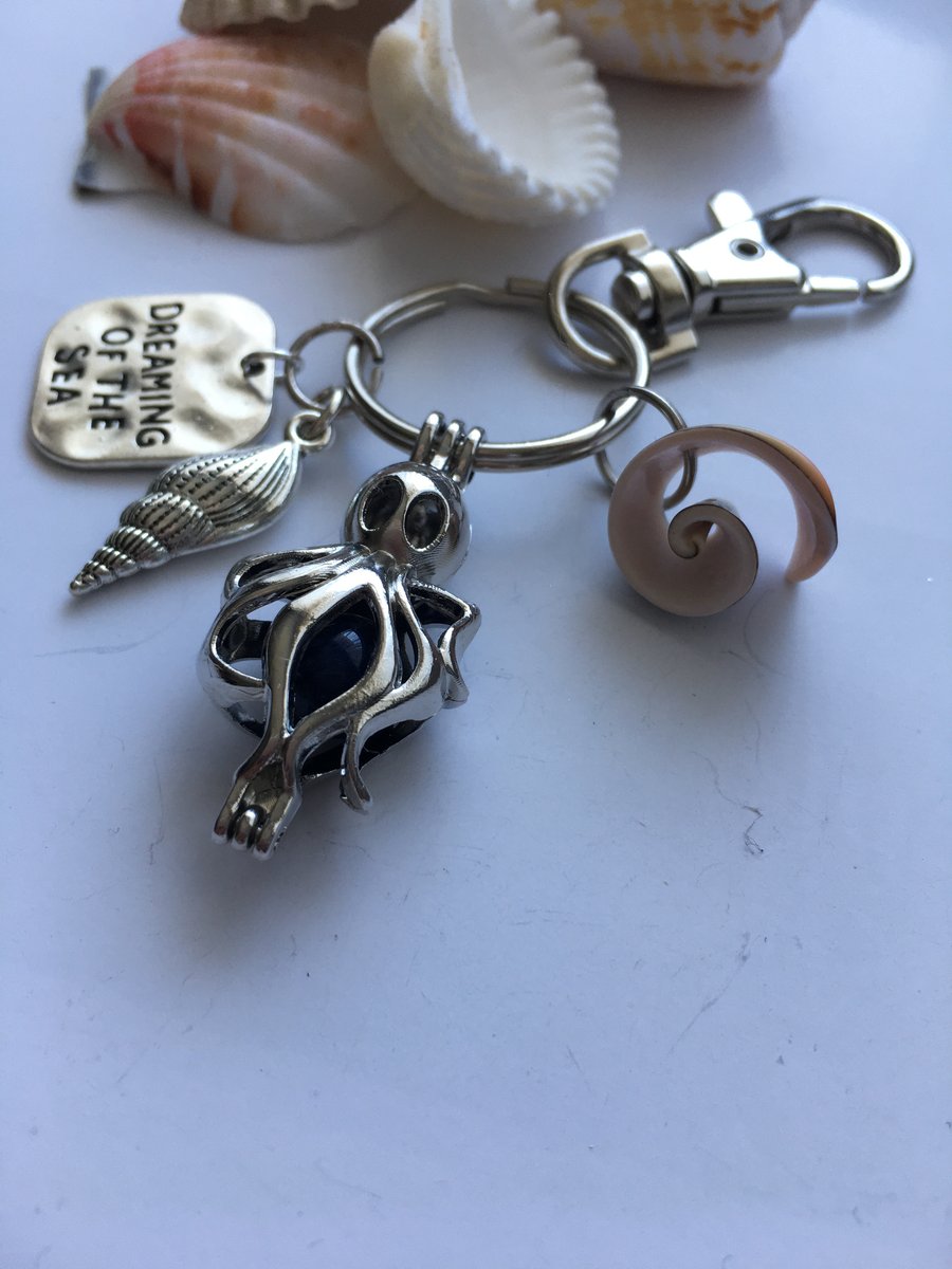 Sea inspired key ring with charms and shell.