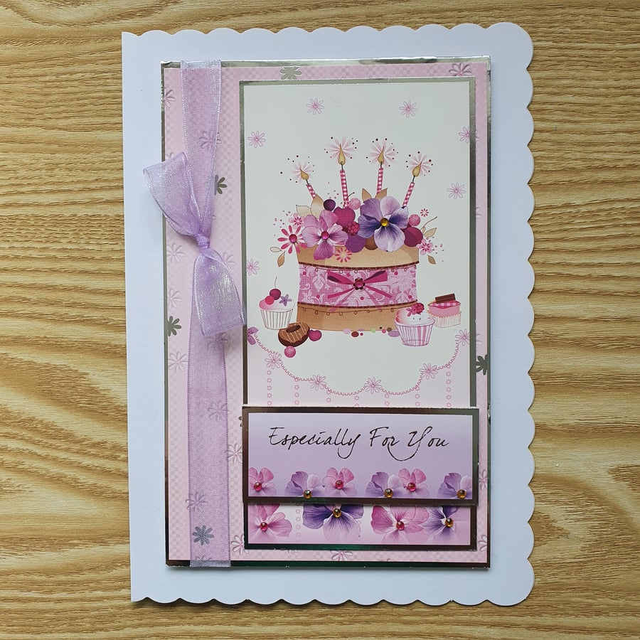 A cake with candles birthday card