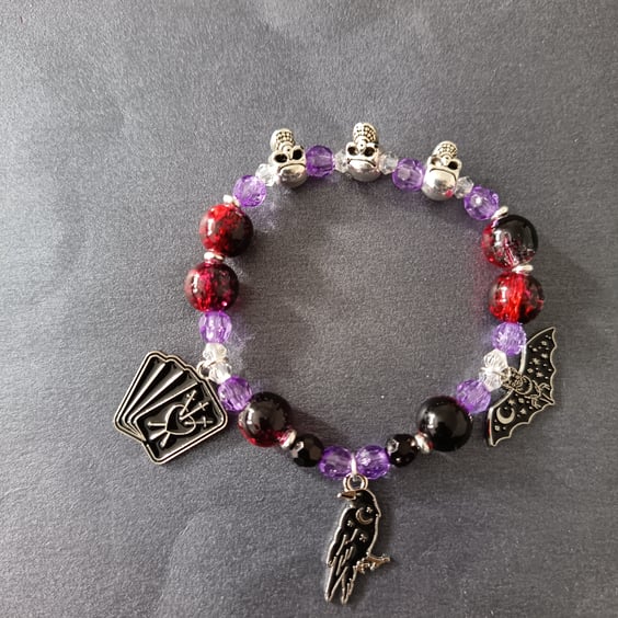 Elasticated gothic charm bracelet with silver skull and coloured glass beads