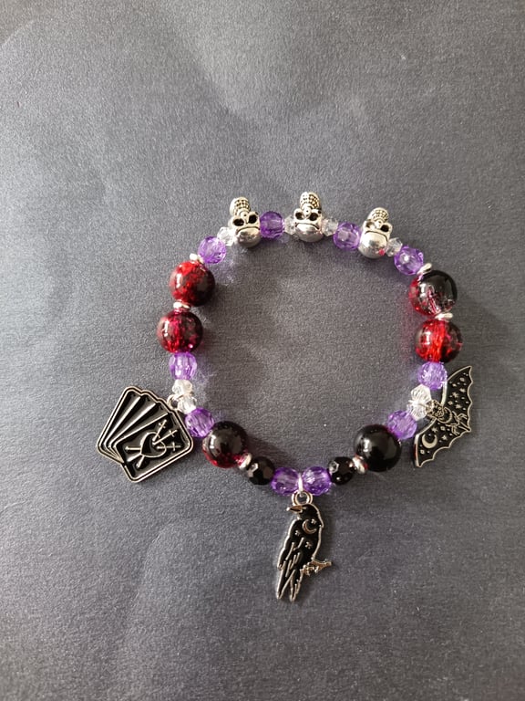 Elasticated gothic charm bracelet with silver skull and coloured glass beads
