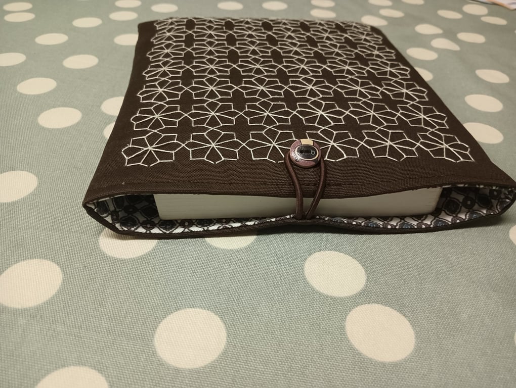 Brown book sleeve with sashiko embroidery detail 