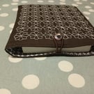 Brown book sleeve with sashiko embroidery detail 