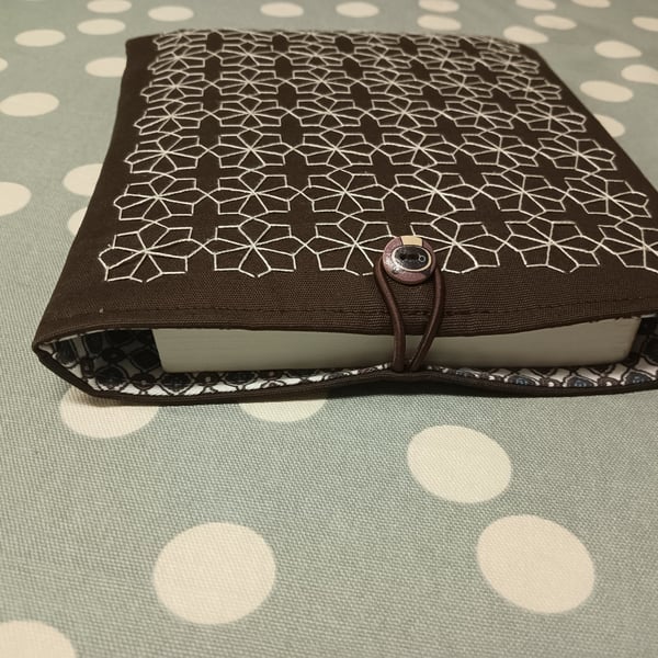 Brown book sleeve with sashiko embroidery detail 