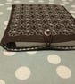 Brown book sleeve with sashiko embroidery detail 