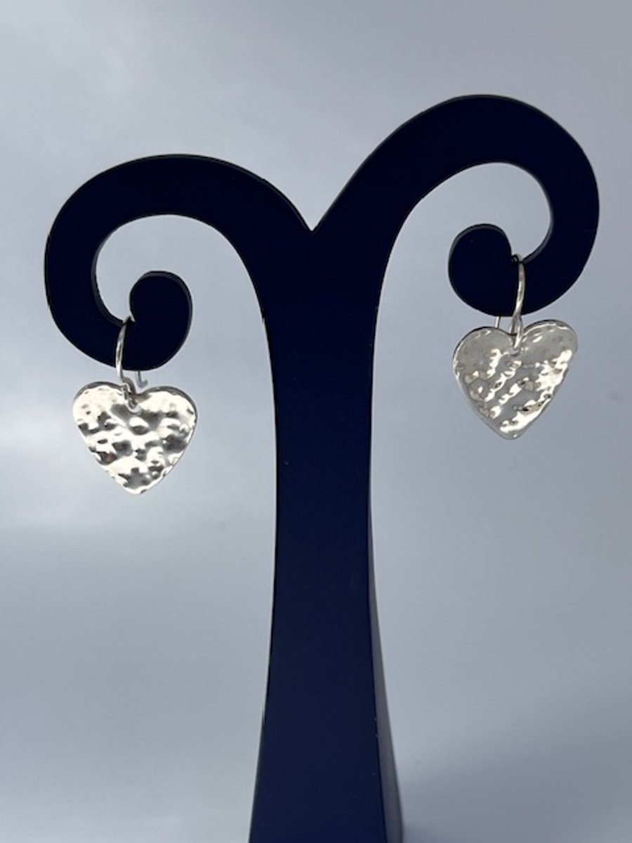 Silver heart earrings with hammered texture