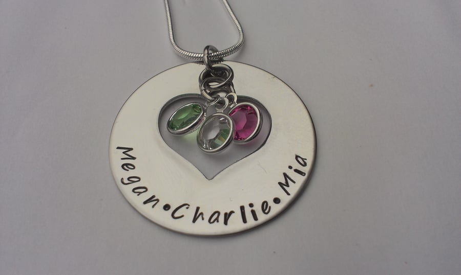 Hand stamped round pendant with heart cutout