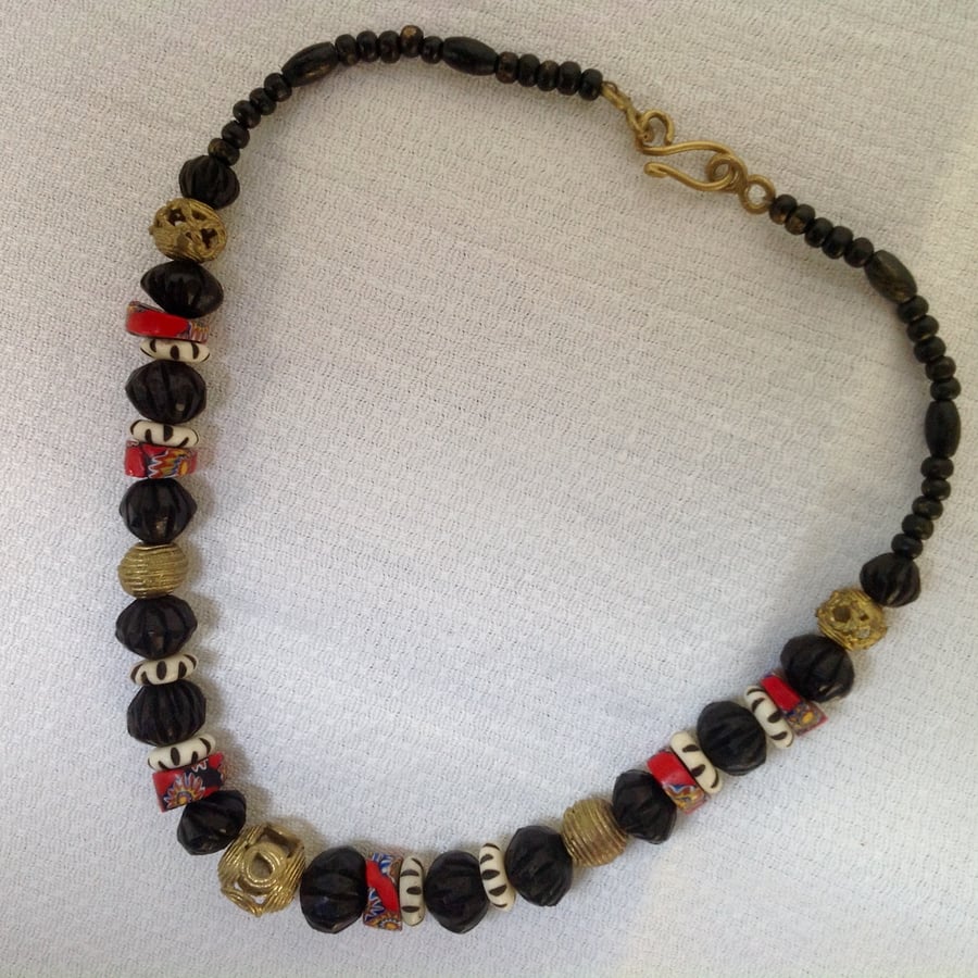 Black, white and red necklace with antique trade beads, African recycled brass