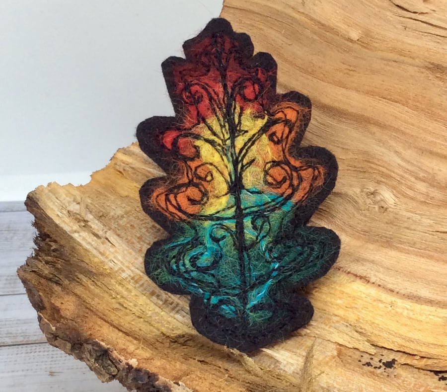Embroidered oak leaf brooch. 