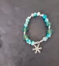 Elasticated winter beaded bracelet with crystal chip and snowflake charm - Image 3