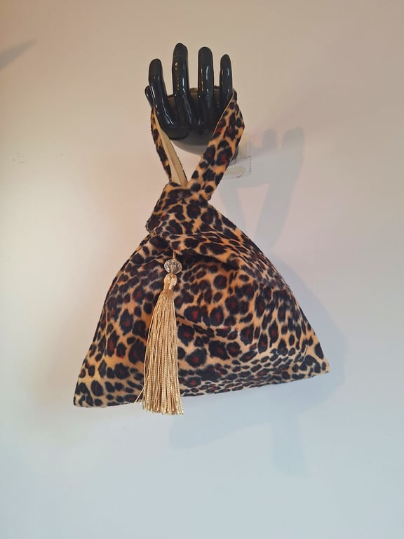 Leopard print faux fur fabric Japanese Knot bag with tassel & cream satin lining