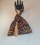 Leopard print faux fur fabric Japanese Knot bag with tassel & black satin lining