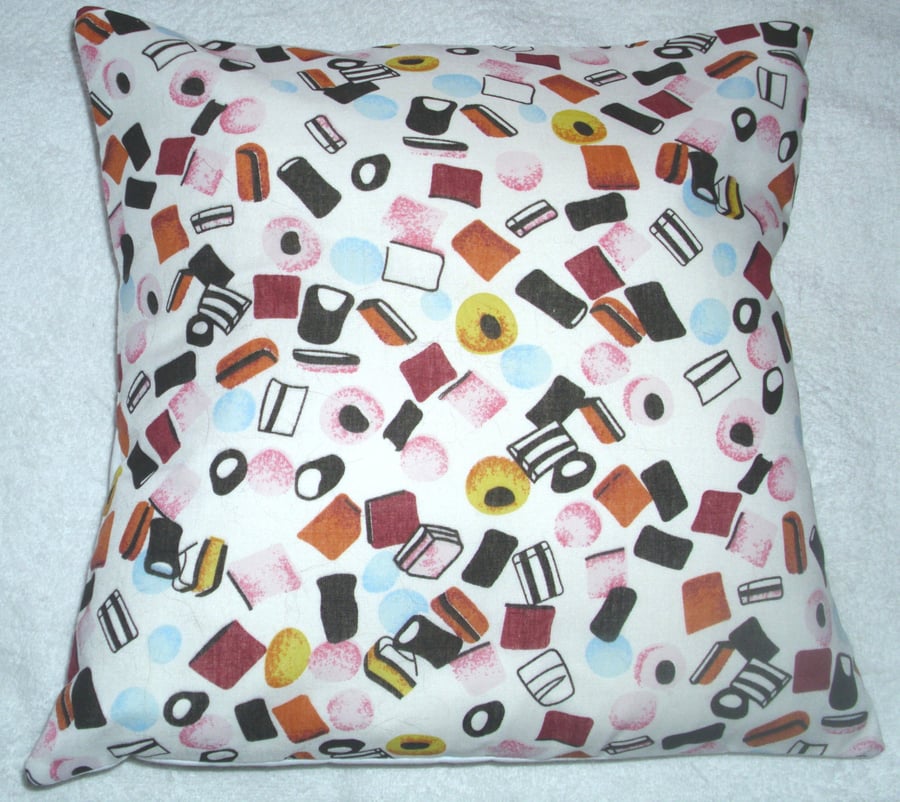 Liquorice Allsorts on white Cushion