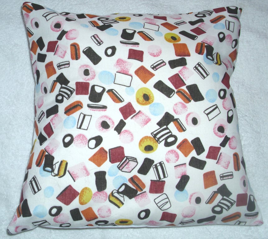 Liquorice Allsorts on white Cushion