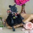 'Aline', a black porcelain and textile mouse doll.