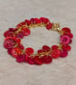 Red button bracelet with gold chain and toggle clasp  - Image 3