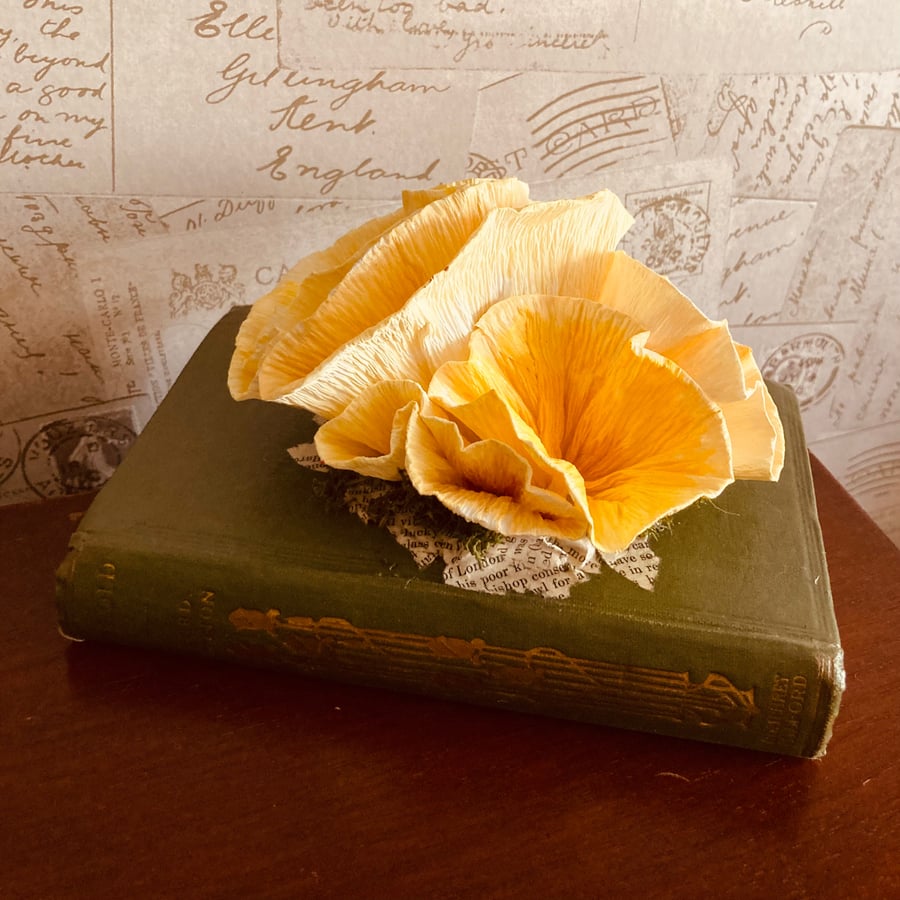 Paper Yellow Oyster Mushrooms in a Vintage Book