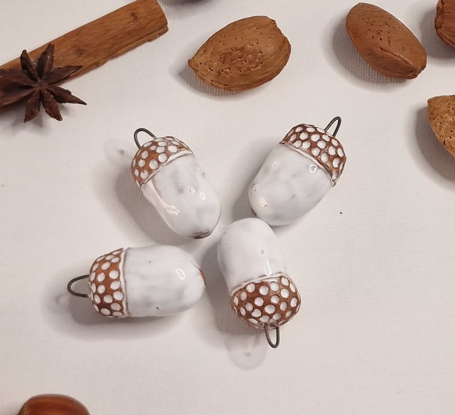 Handmade Ceramic Acorns. Hanging decorations both autumn and in Christmas time. 