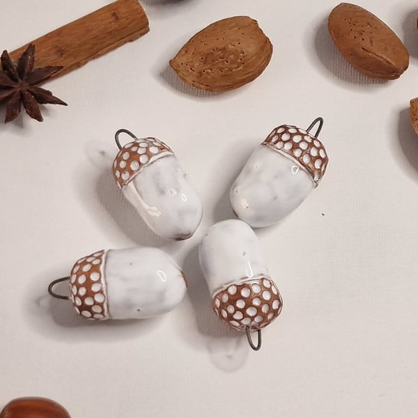 Handmade Ceramic Acorns. Hanging decorations both autumn and in Christmas time. 