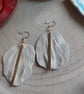 Hand-made Clay leaf-shaped dangling earrings in brass accessories.