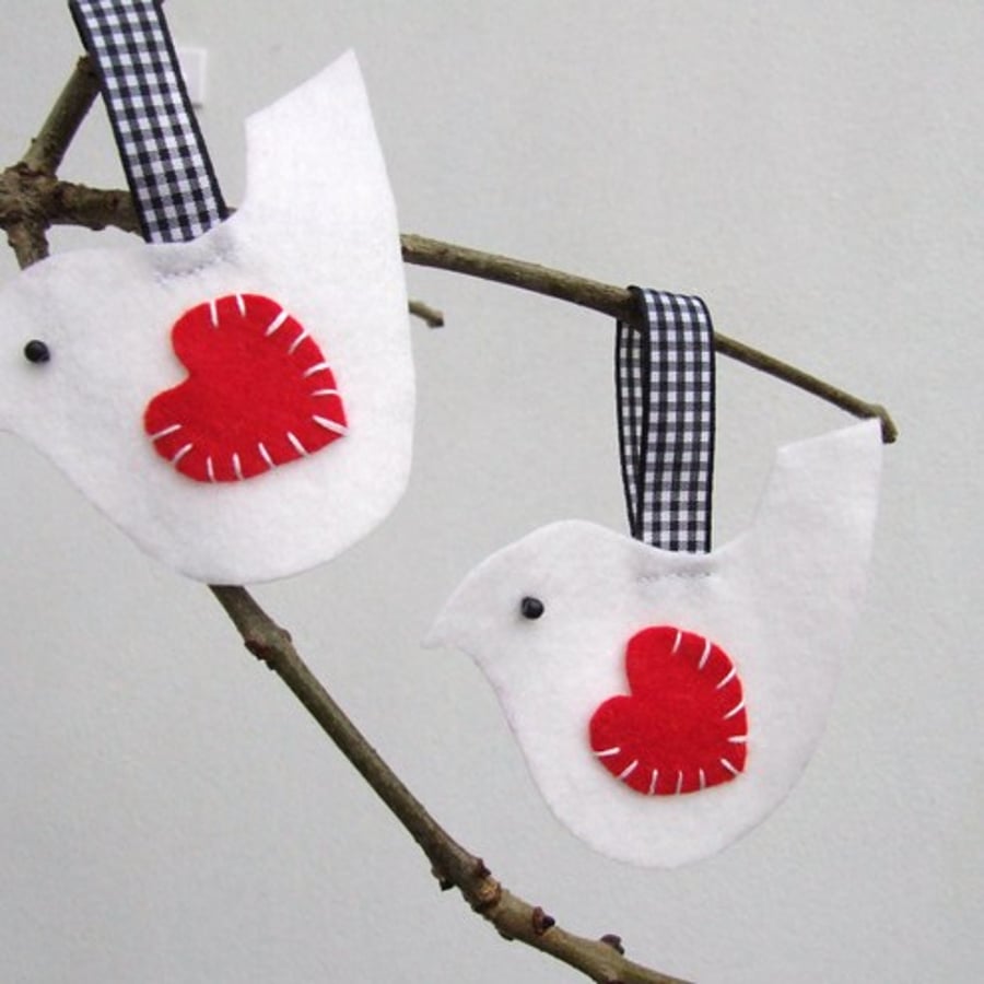 Two felt bird decorations, white bird gift tags, present toppers