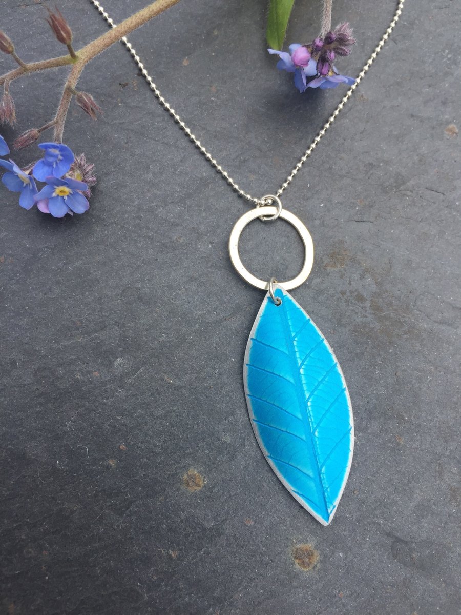 Turquoise anodised aluminium, distressed leaf pendant with silver ring