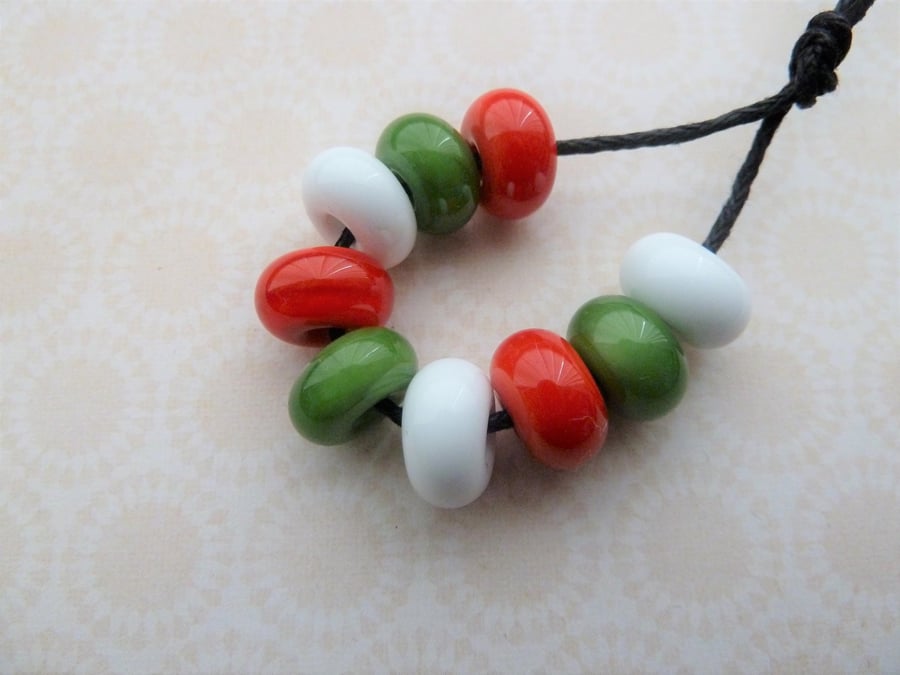 green, red and white lampwork glass spacer beads