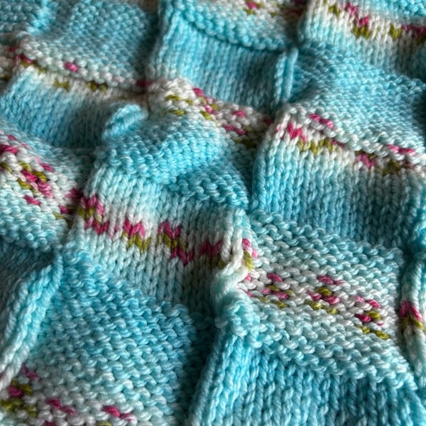 Beautiful handknitted baby blanket in Hayfield Baby Blossom Chunky wool
