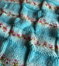 Beautiful handknitted baby blanket in Hayfield Baby Blossom Chunky wool