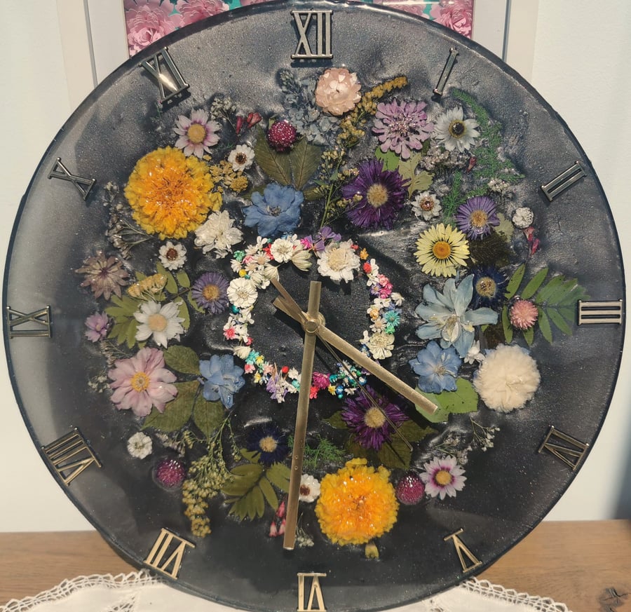 Large floral wall clock, dried flower arrangement.