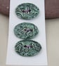 3 Medium Oval Dark Jade Green Brocade Pattern Ceramic Buttons - Image 1