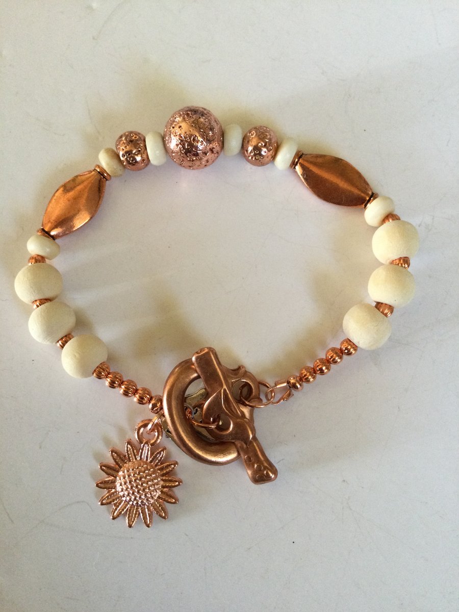 Copper and sandalwood beaded bracelet with sunflower charm