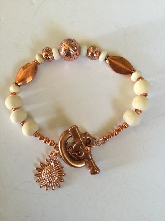 Copper and sandalwood beaded bracelet with sunflower charm