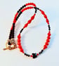 Red Bamboo Coral Necklace With Black Spinel, Onyx And Swarovski Butterfly - Image 1