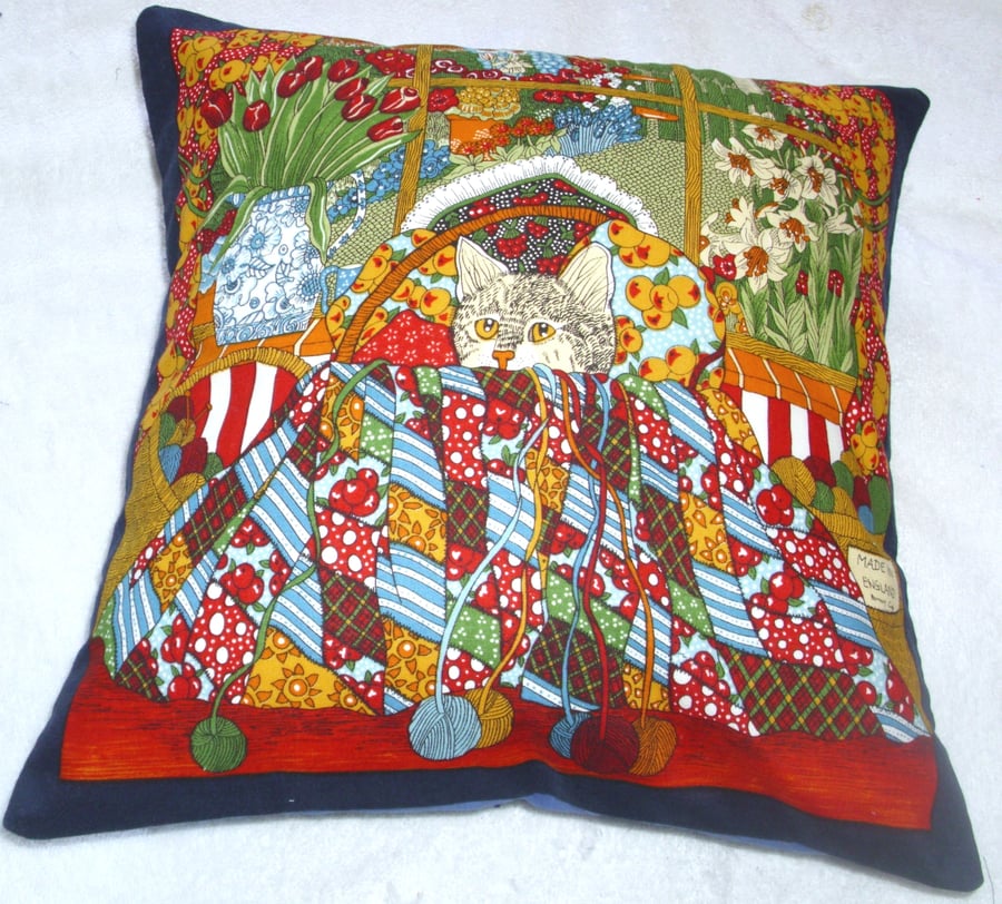 A tabby kitten in the work basket cushion 