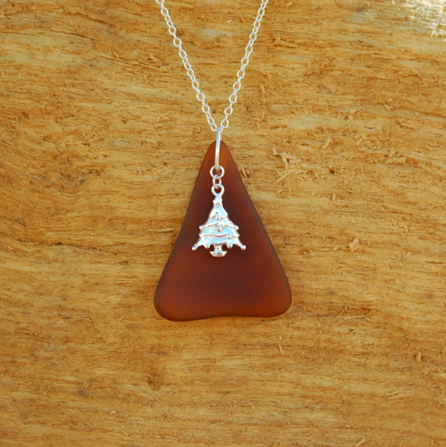 Brown beach glass pendant with Christmas tree charm