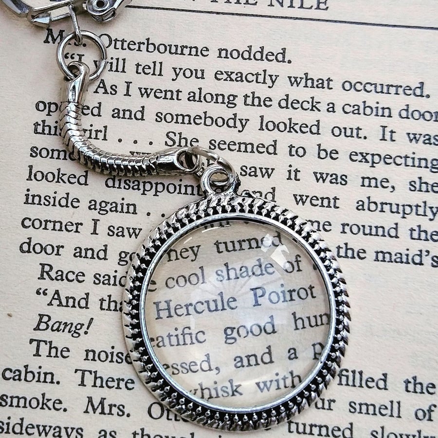 Agatha Christie Hercule Poirot keyring made with an upcycled book page 