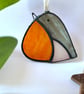 Stained glass robin suncatcher in a black patina finish 