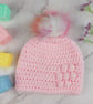 Pink Crochet Baby Hat Newborn to 3 Months with Bobble Flower and Rainbow Pom - Image 1