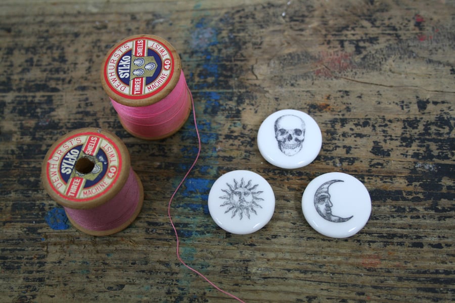 A set of three bone china buttons 