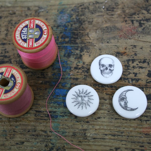 A set of three bone china buttons 