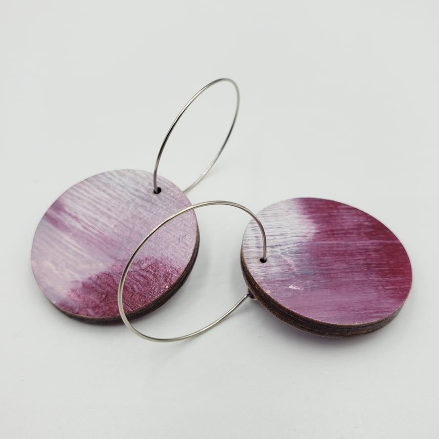 Plum and white earrings in an abstract print