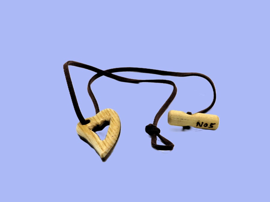 Pierced heart pendant, handcarved from two woods. SKU-N05 