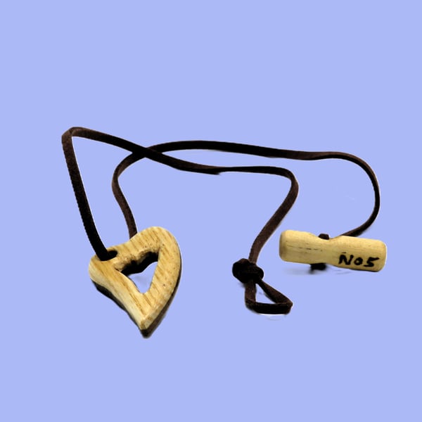 Pierced heart pendant, handcarved from two woods. SKU-N05 