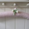 Knitted padded ladies palest pink coat hanger with large peony flower