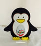 Penguin Holding a Kinder Egg - Image 1