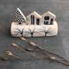 Ceramic row of little houses. 