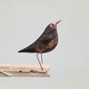 Pecking peg bird