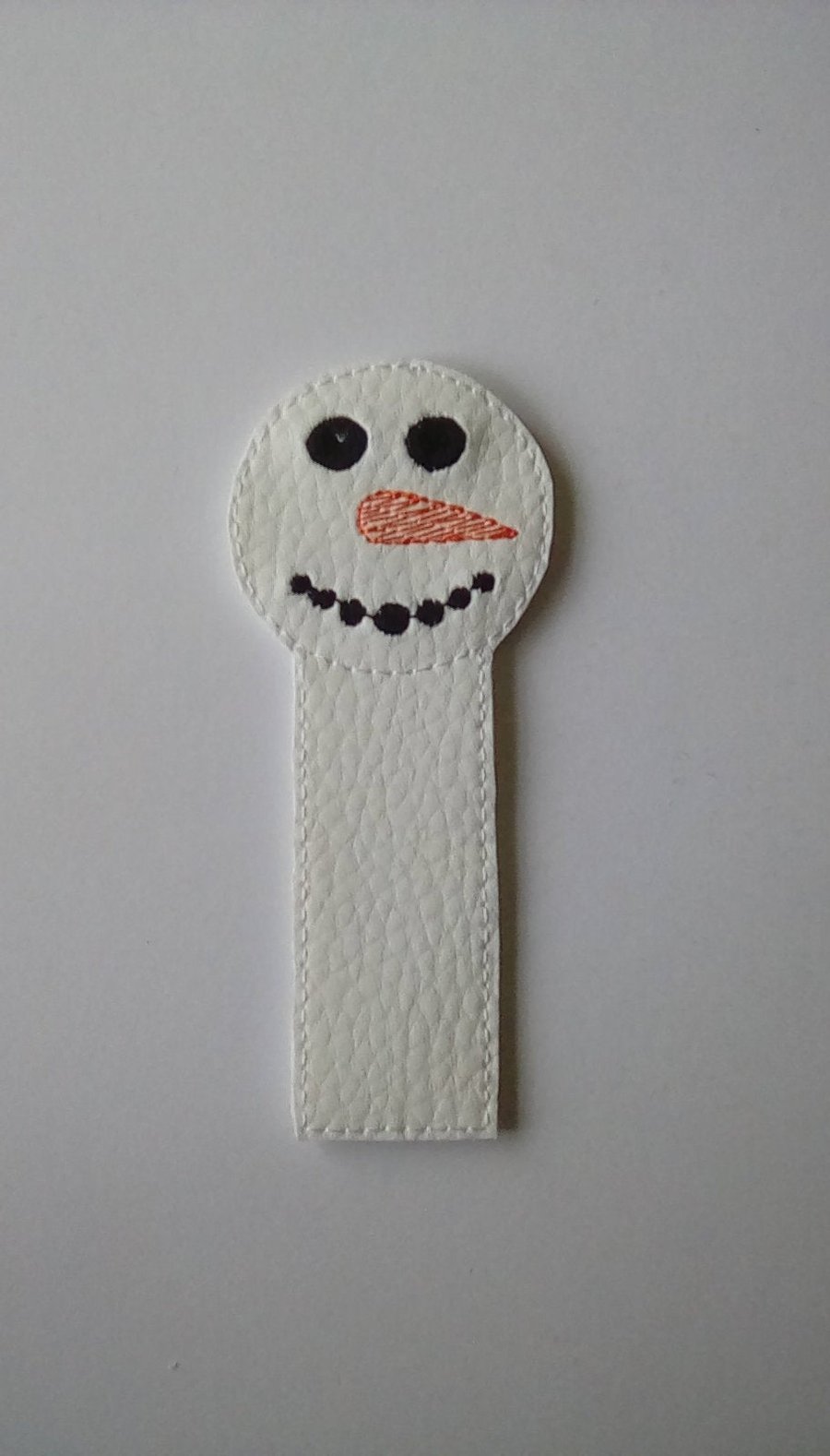 663. Dot mouth snowman bookmark.